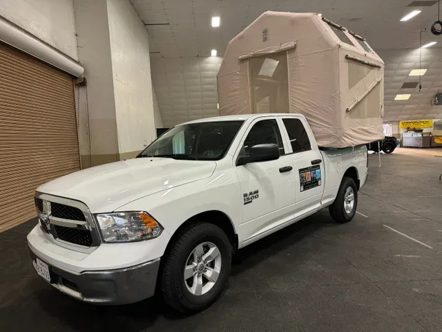 Transformer set up in the bed of a white pickup truck
