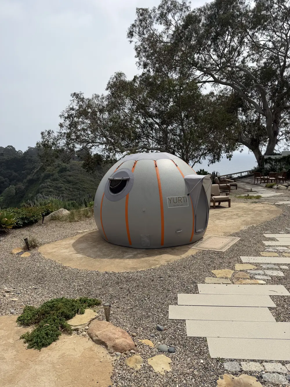 YURTi set up on a gravel backyard terrace overlooking a canyon